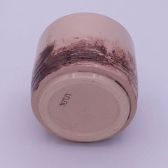 Bottom view of a handmade 200 ml stoneware Yunomi cup, showing the natural iron oxide pattern continuing around the lower surface.