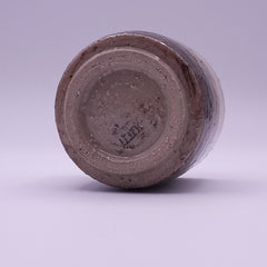 Handleless stoneware Yunomi cup with warm natural pigment tones from iron oxide and terra rosa