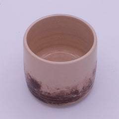 Handmade 200 ml Yunomi cups in cream stoneware with irregular natural iron oxide patterns, shown as a small group.
