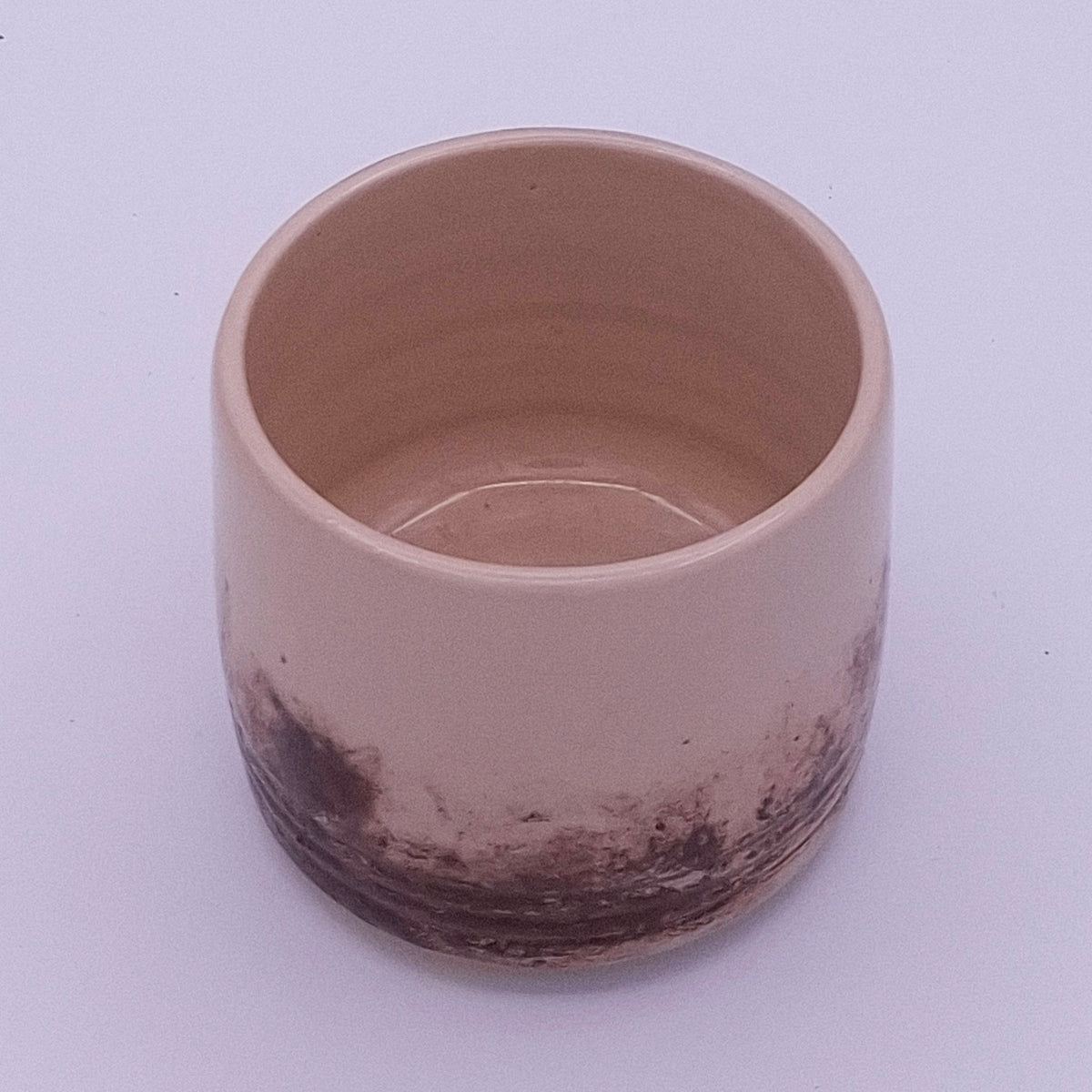 Handmade 200 ml Yunomi cups in cream stoneware with irregular natural iron oxide patterns, shown as a small group.