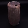 Handmade Rubble Vase II in anthracite stoneware with an iron oxide surface and textured mineral details, shown against a black background.
