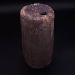 Handmade Rubble Vase II in anthracite stoneware with an iron oxide surface and textured mineral details, shown against a black background.